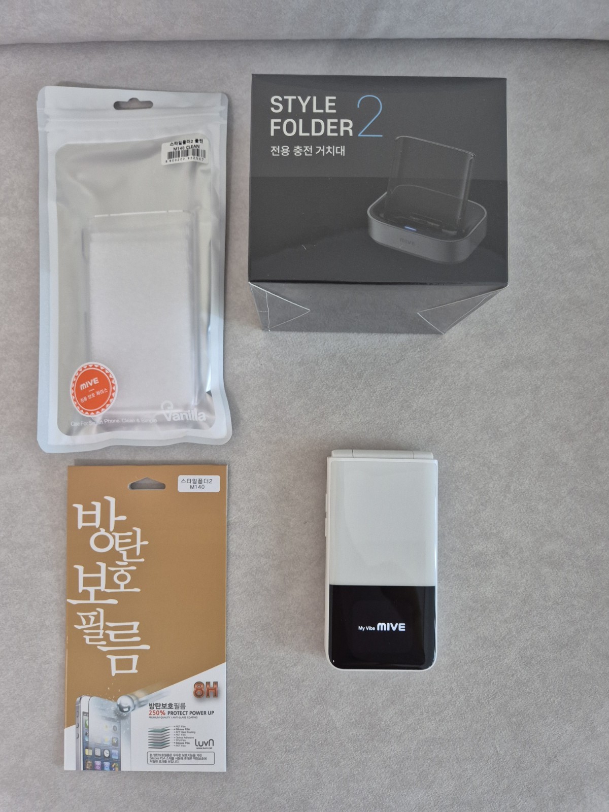 ALT MIVE AT-M140 Style Folder 2 cell phone 32GB LTE/3G – Black , White Used /