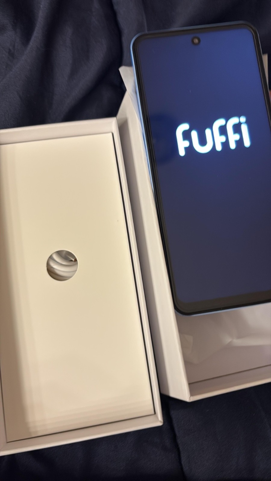 Is a fuffy iPhone, is purple with kind of blue has 3big cameras, is not used,