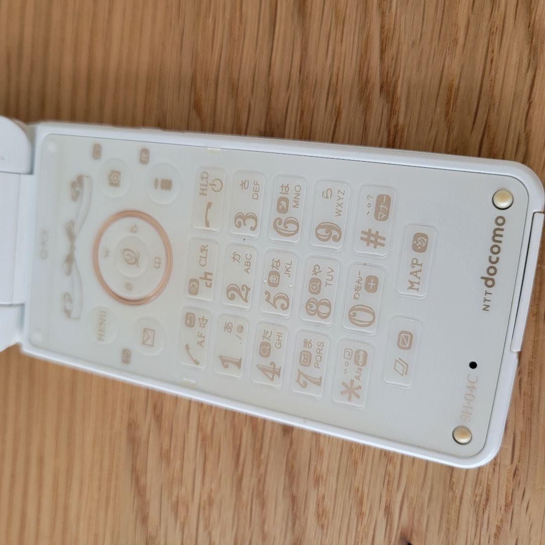 docomo × Q-pot. SH-04C feature phone main unit Sharp Biscuit white milk Japan